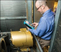 AEGIS technician taking shaft voltage measurement in an HVAC system