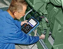 A commissioning agent tests a VFD-fed motor for the presence of shaft voltage.